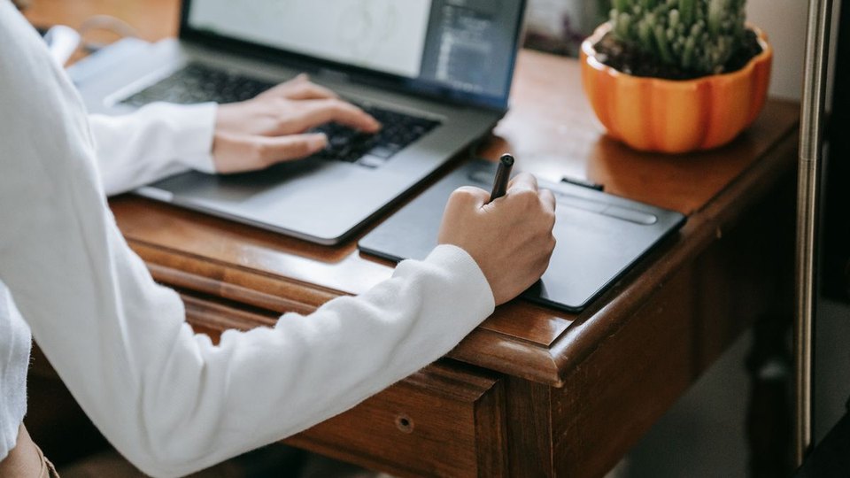 Designer drawing on a graphics tablet