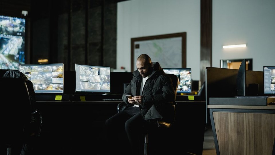 An operator viewing screens in a control room