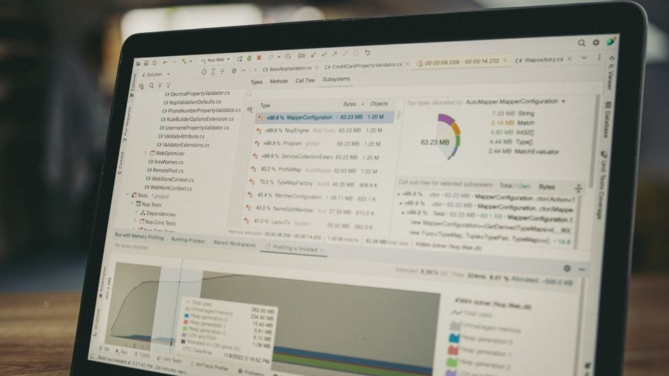 A laptop displaying coding and data-analysis software